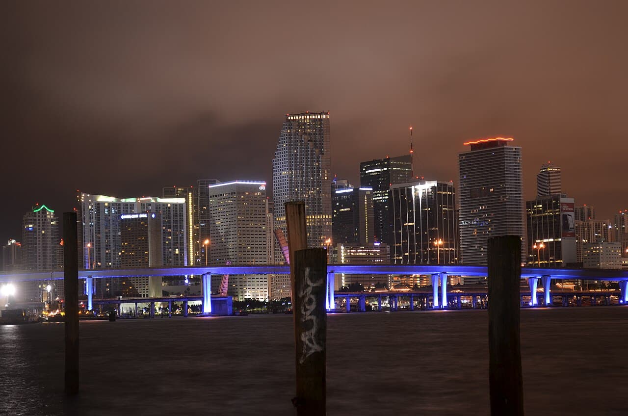 Downtown Miami skyline across Biscayne Bay at night.