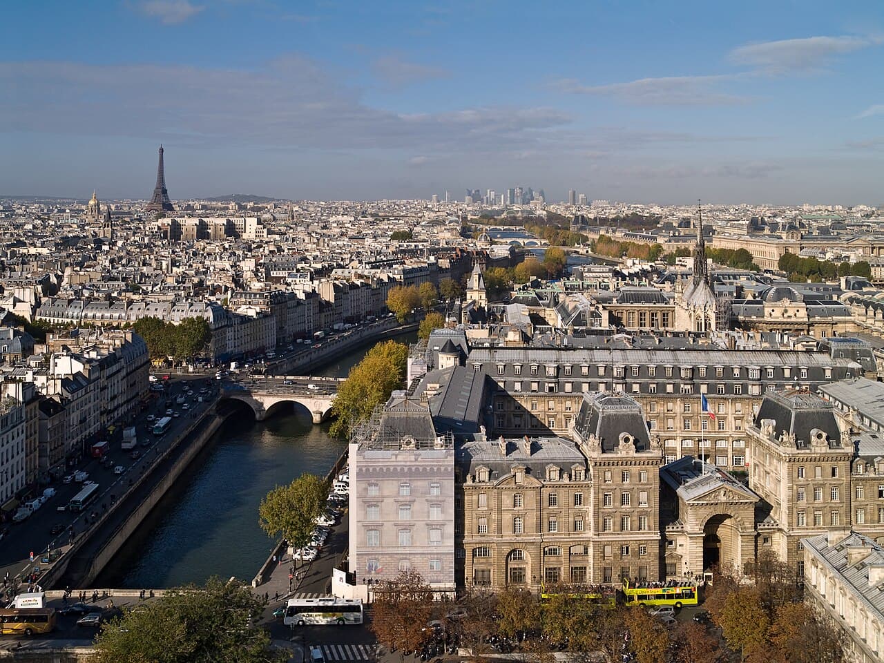 Paris rooftops, the Seine, and the Eiffel Tower in the distance.