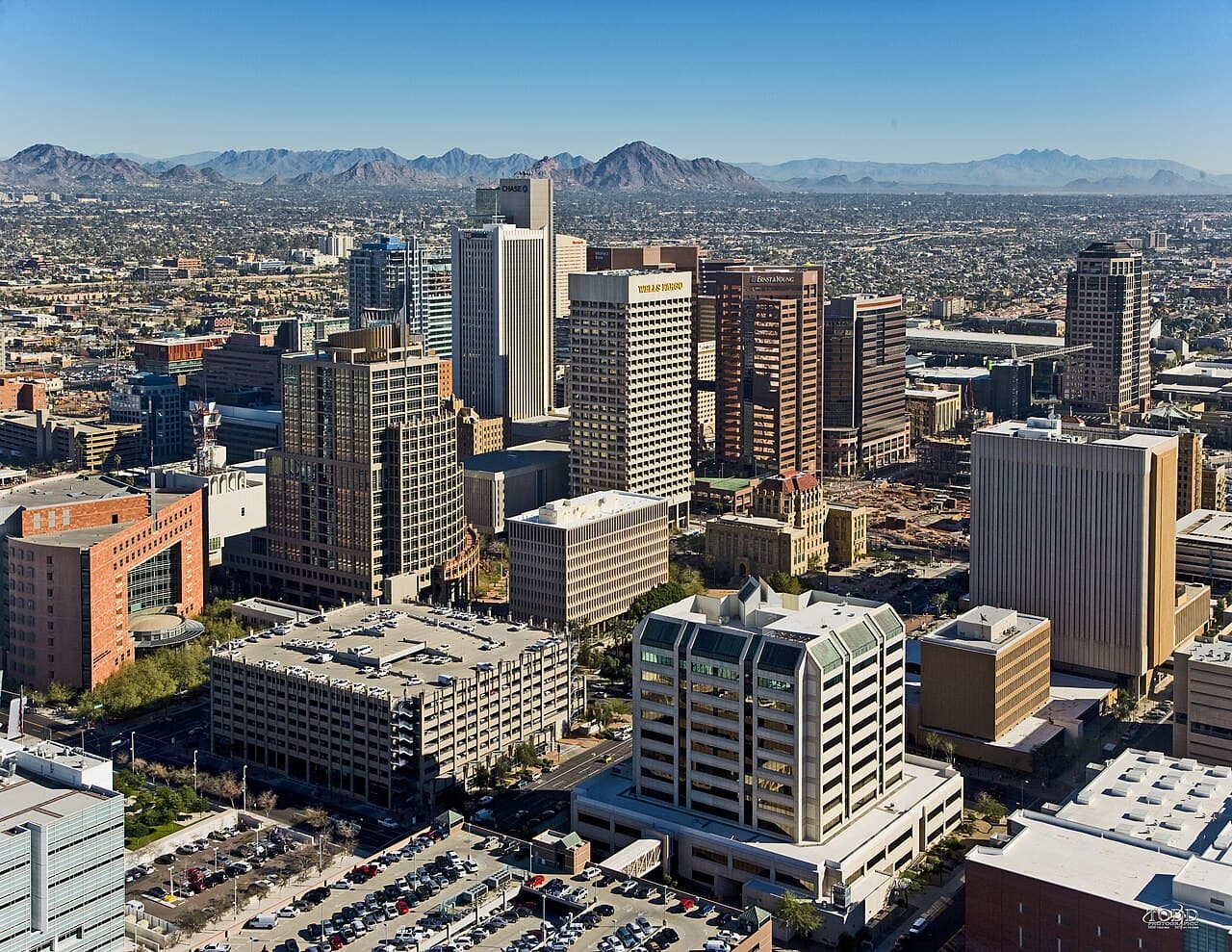 Aerial view across downtown Phoenix toward Camelback Mountain.